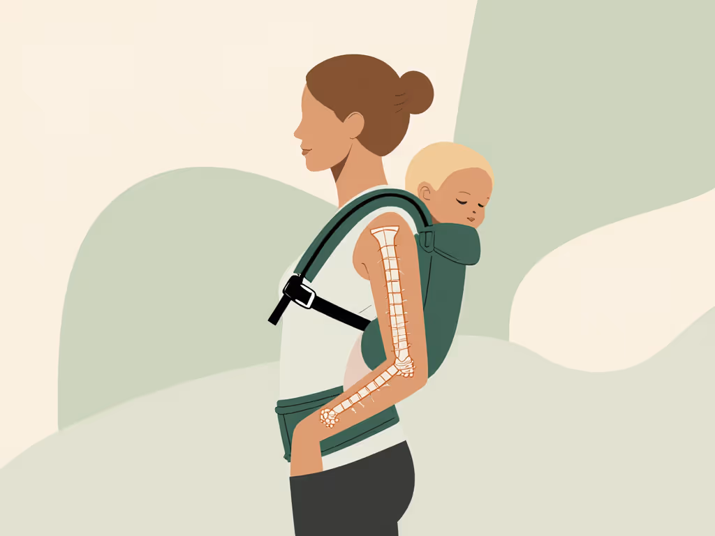 caregiver_wearing_structured_baby_carrier_with_neutral_posture_and_good_strap_alignment