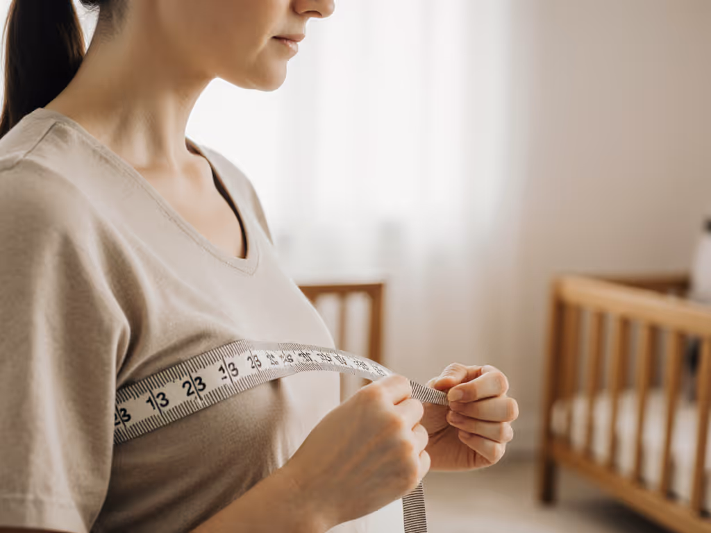 caregiver_measuring_torso_for_carrier_fit